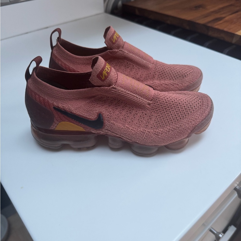 Nike Pink and Black Flyknit Athletic Shoes